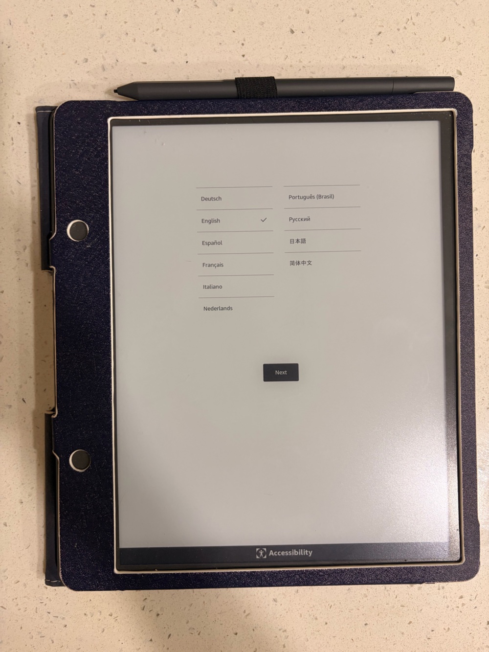 Amazon E-Reader in Silver with Dark Blue Cover and Stylus